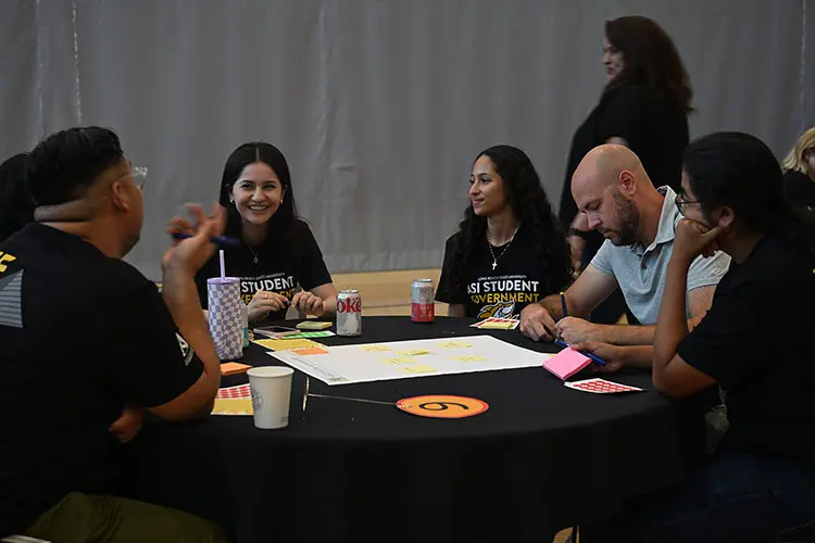 students discussing topics with architects