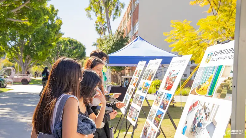 students looking at poster boards