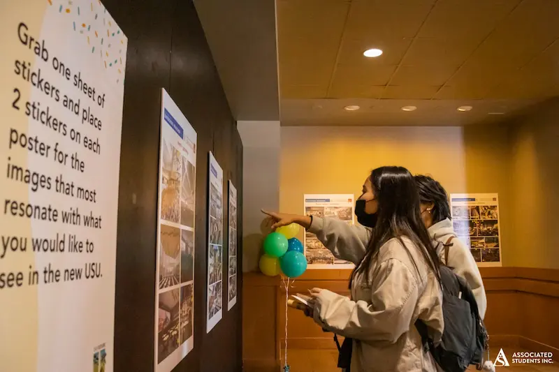 students looking at designs