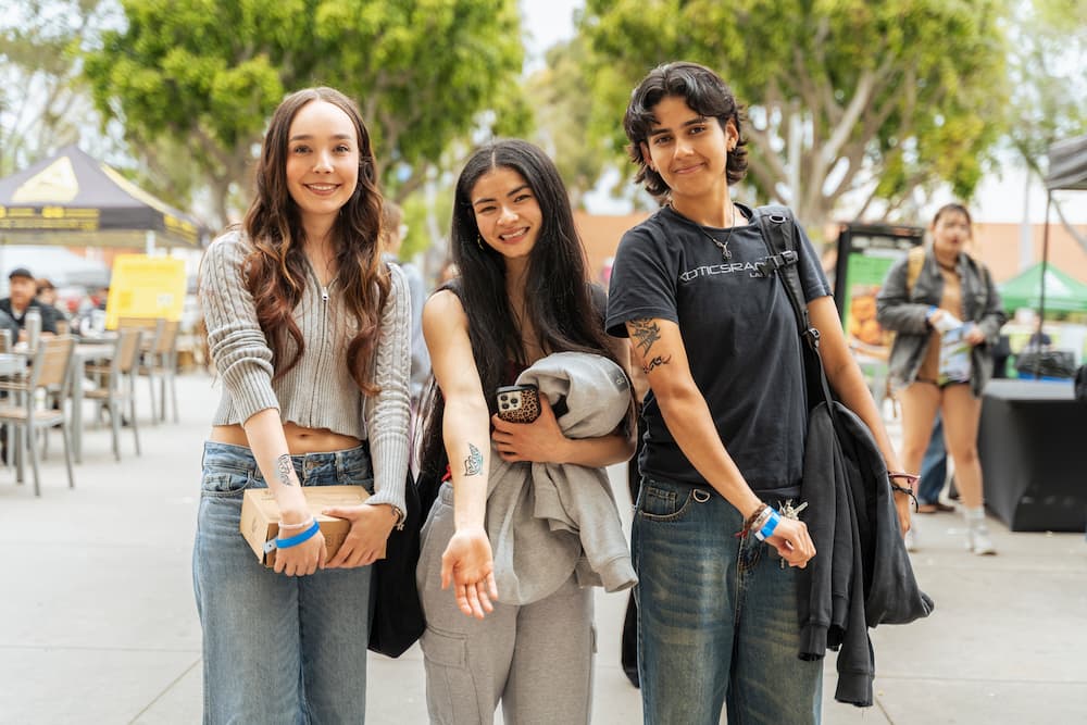 Students at block party with henna tattoos